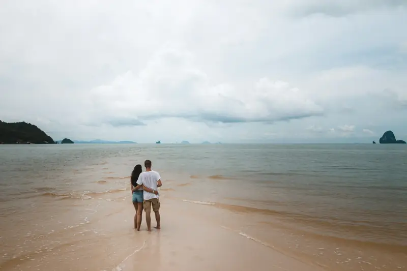 A couple on a quiet Thai beach