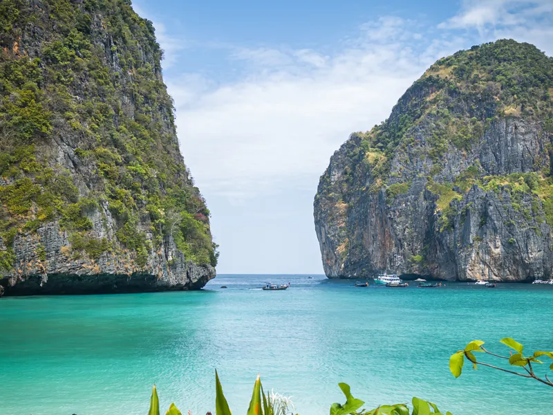 Turquoise water between limestone cliffs at Maya Bay