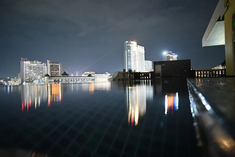 Rooftop infinity pool with Pattaya city lights